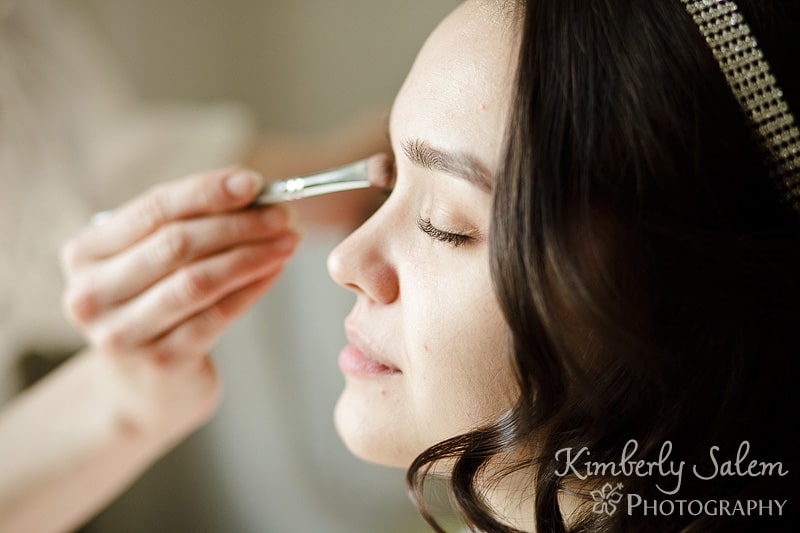 bride getting her makeup put on