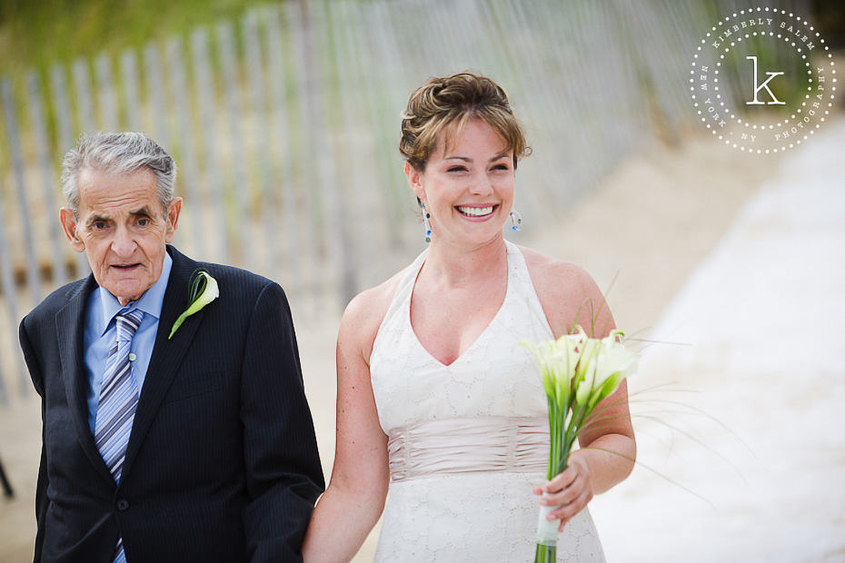 bride walking down the aisle - beach wedding