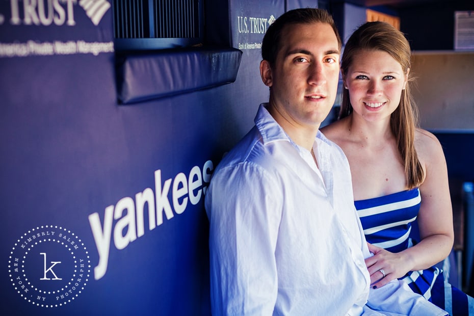 engaged couple at yankee stadium in dugout