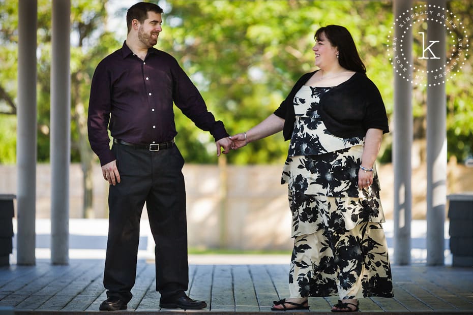 engaged couple holding hands