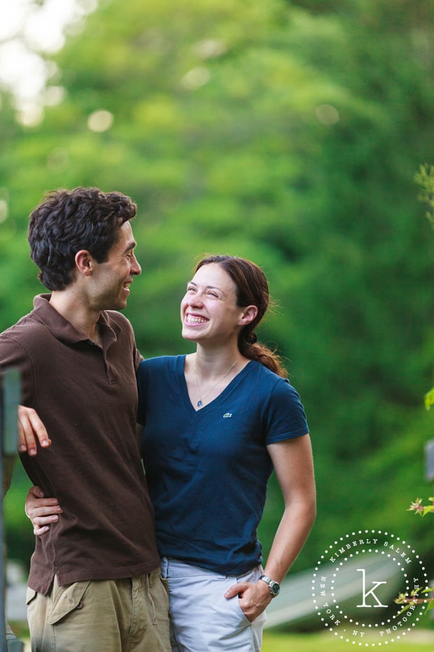 engaged couple smiling at each other