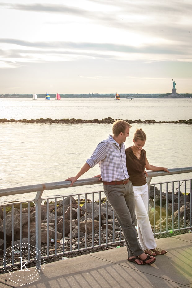 engaged couple in Brooklyn, NY - Red Hook - view of statue of liberty