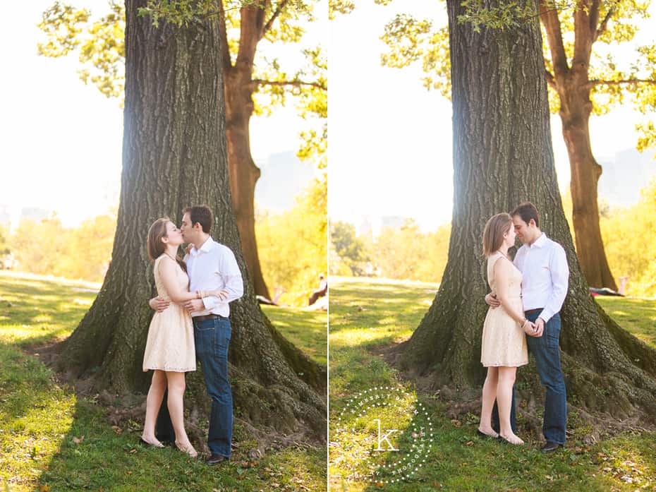 engaged couple in front of tree in central park