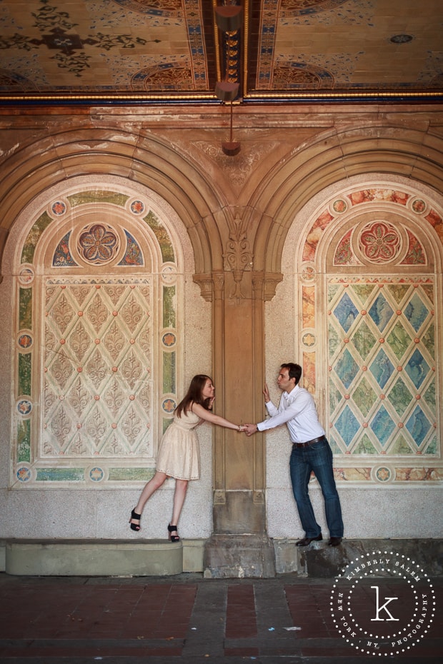 engaged couple at Bethesda Terrace lower passage in Central Park - holding hands