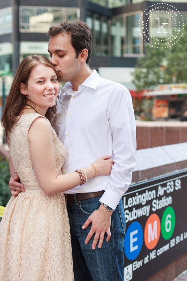 engaged couple by a NYC subway stop