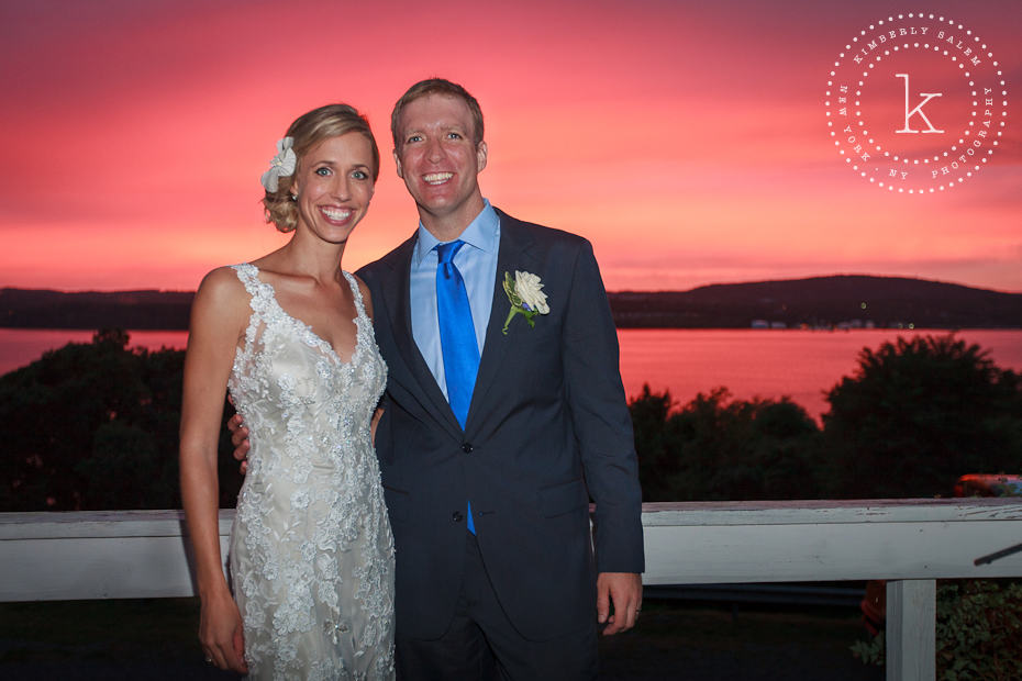 Bride and groom in front of brilliant sunset on the Hudson River