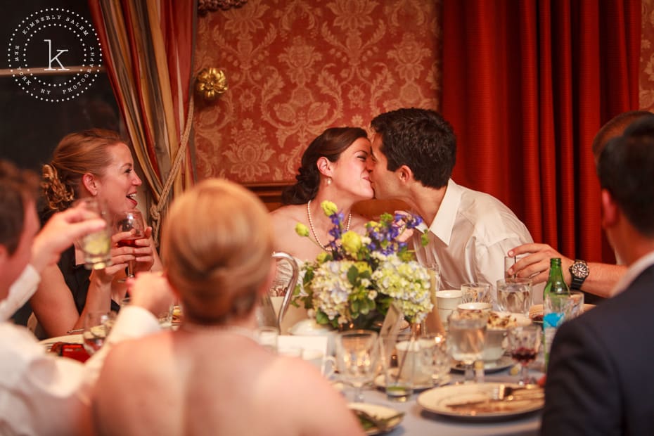 Bride and Groom kiss during wedding reception