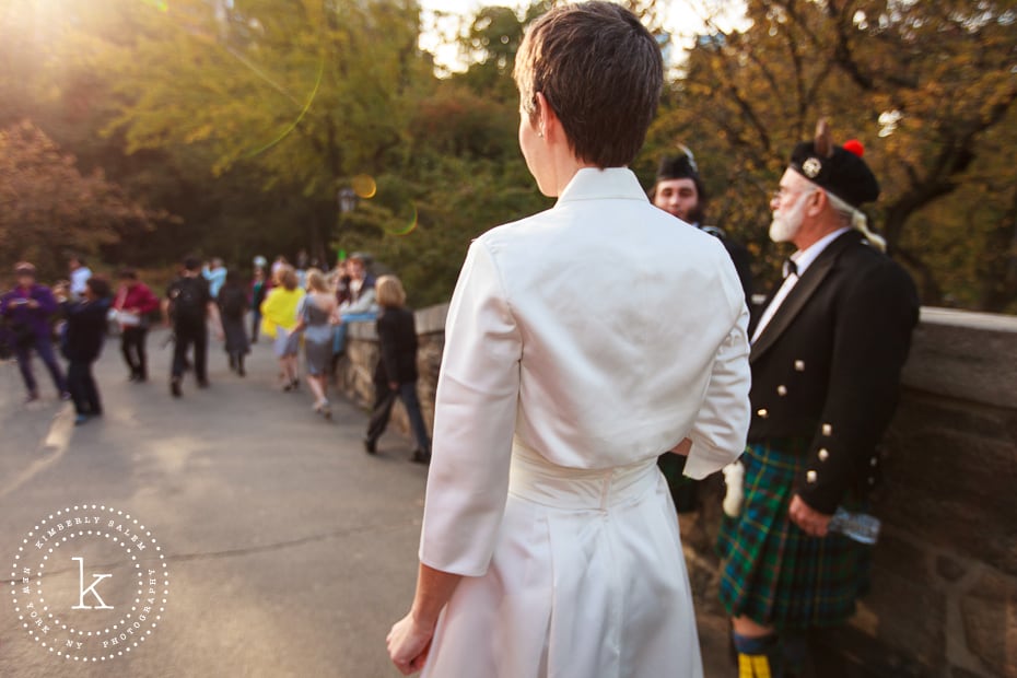 bride crossing Gapstow bridge with bagpipers on the way to the First Look