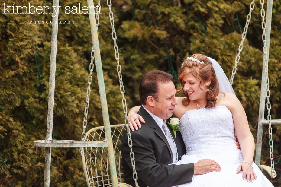 bride and groom on swing