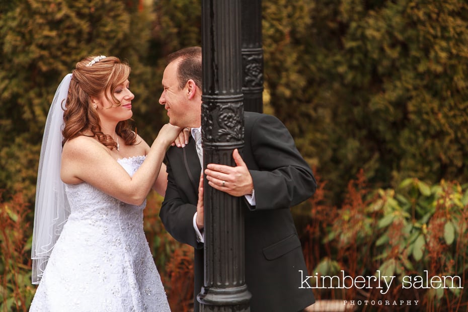 bride and groom play around