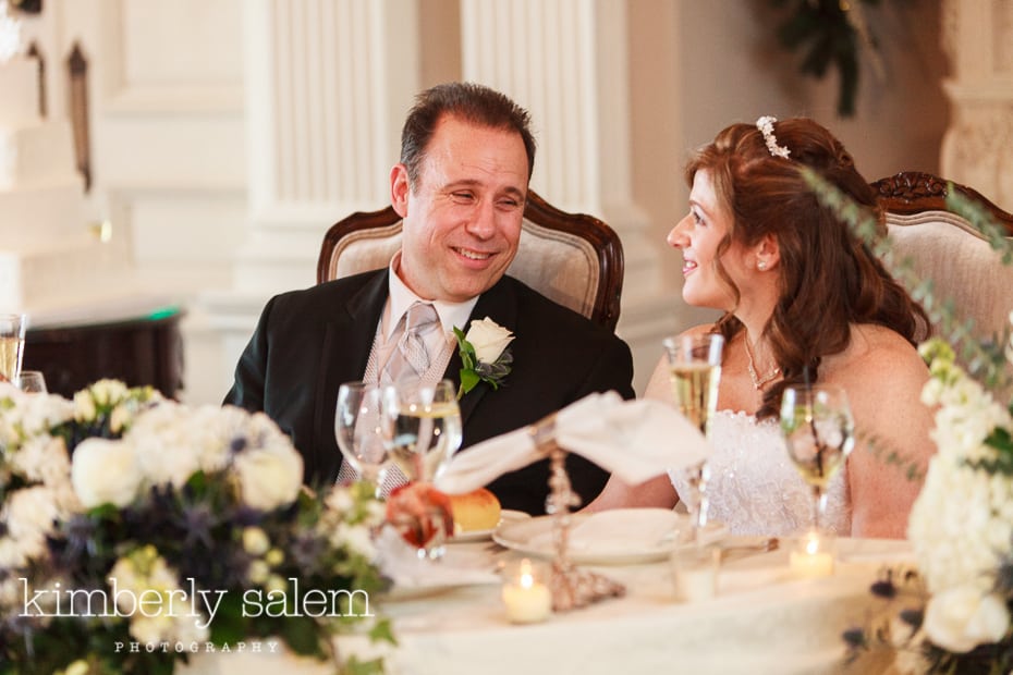 bride and groom listen to speeches