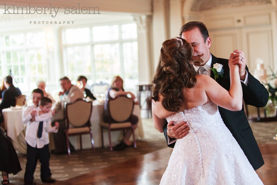 bride and groom first dance (with boys fighting in background)