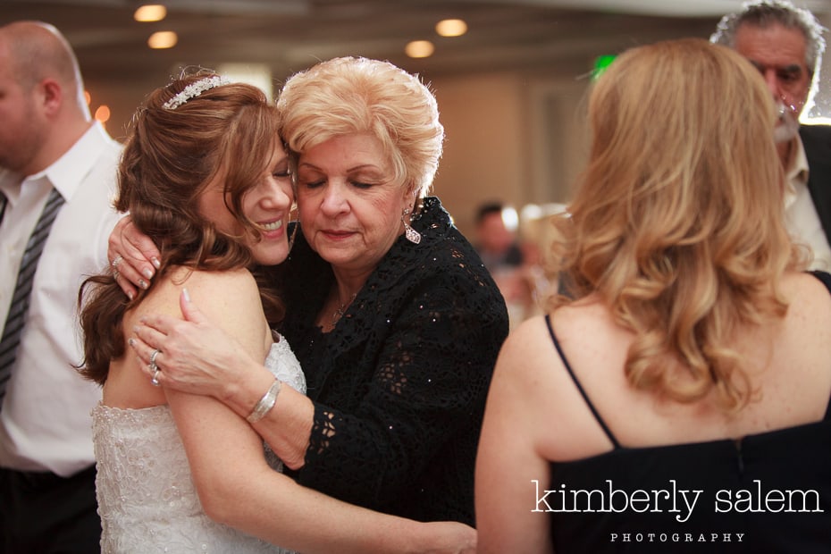 bride and her aunt hug at the wedding