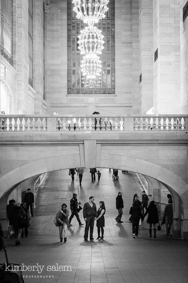 engaged couple under arch in Grand Central