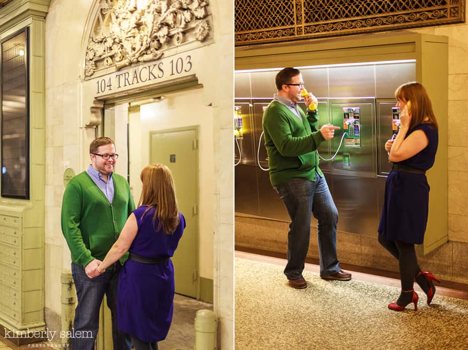 engaged couple having fun with pay phones in Grand Central