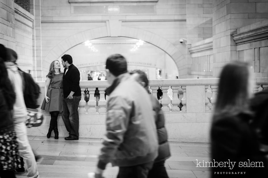 engaged couple kisses in Grand Central