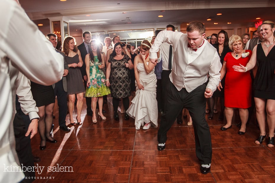 groom dancing the robot while bride watches