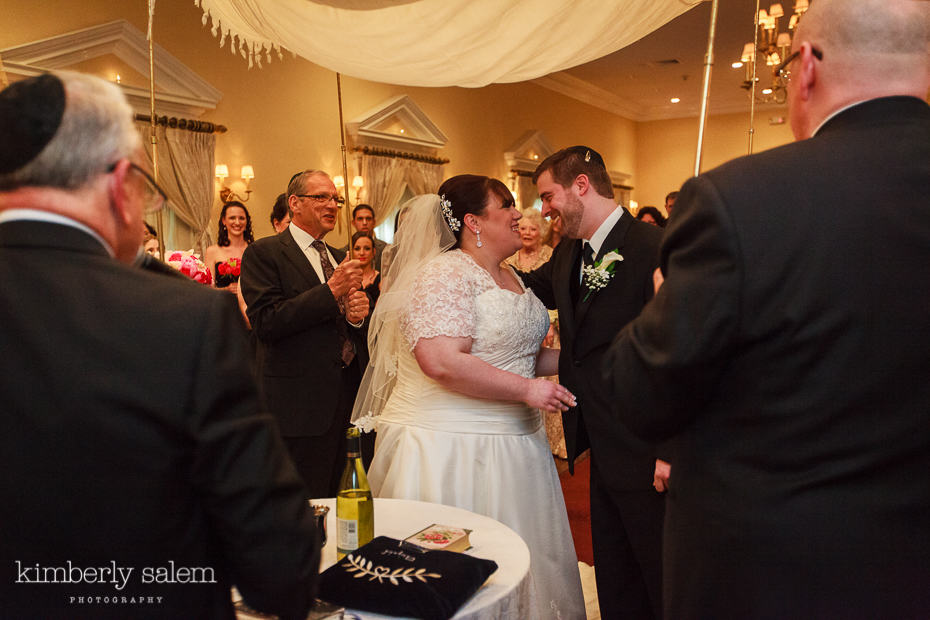 wedding ceremony under the chuppah at Carlyle on the Green