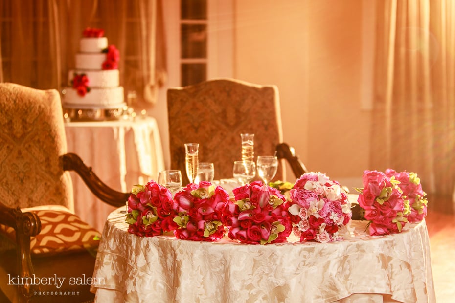 Carlyle on the Green reception detail - champagne flutes, bouquets and wedding cake