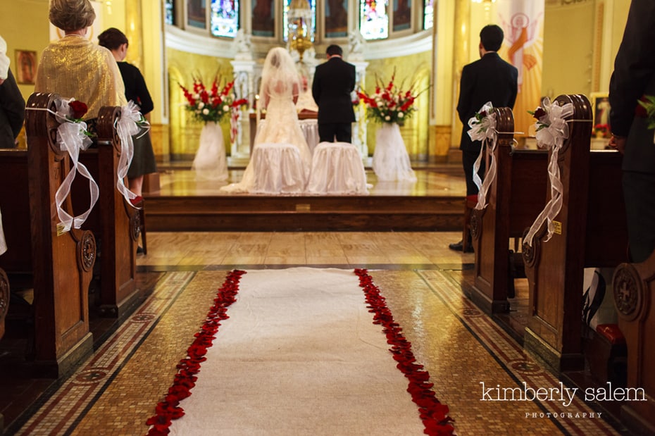 red rose petal aisle runner - church wedding