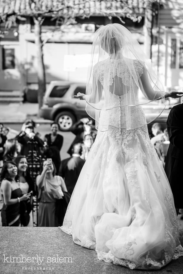 bride looks out at her guests