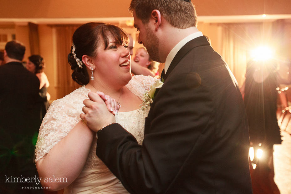 bride and groom share a sweet moment while dancing