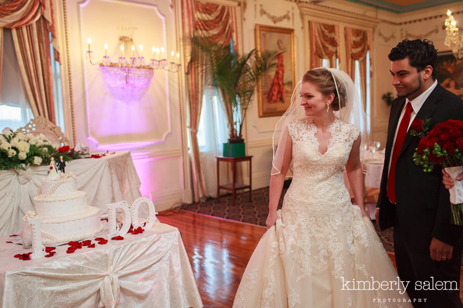 bride and groom see cake for the first time