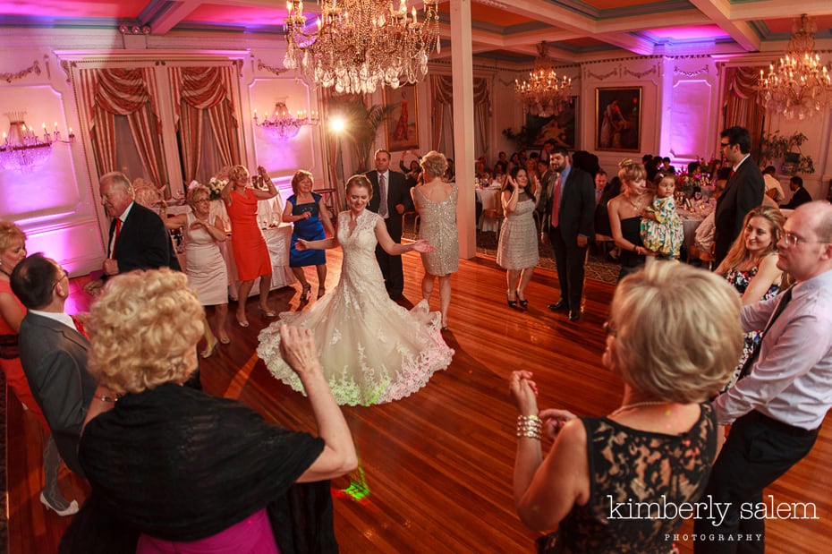 bride's dress flares out as she dances