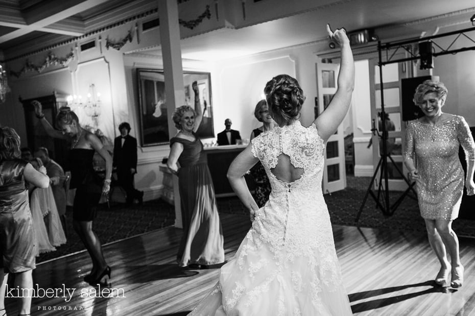 bride dancing with arm in the air