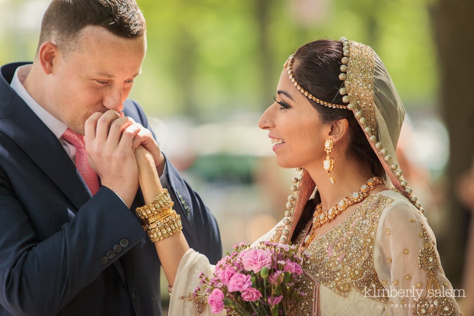 groom kisses bride's hand during First Look