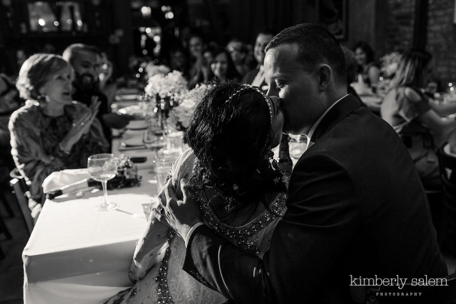 bride and groom kiss after their first dance