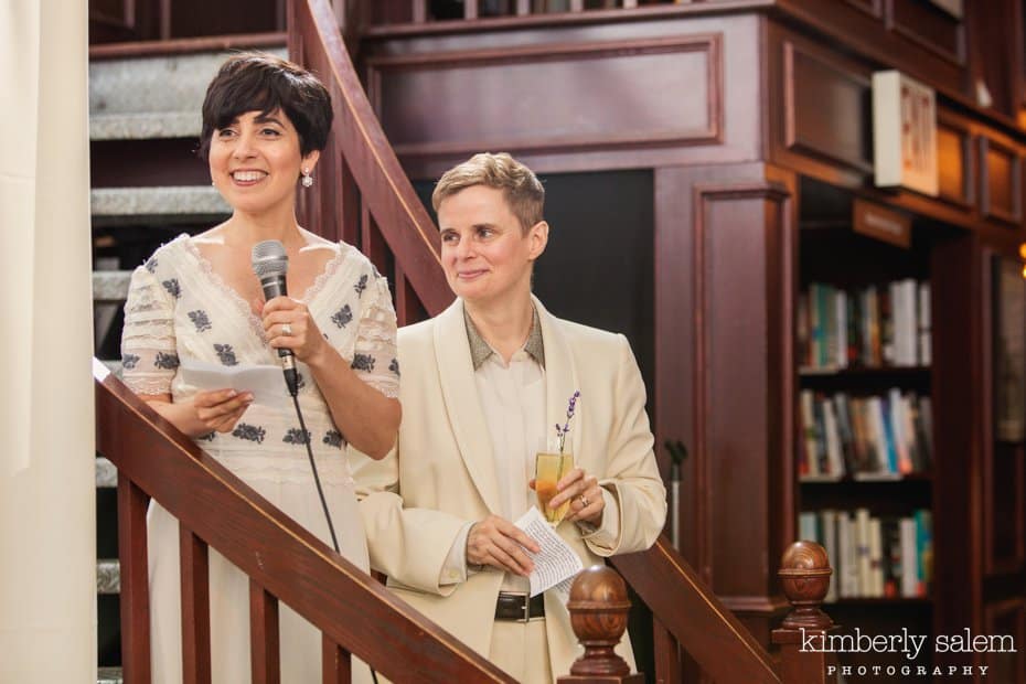 Brides giving a toast in bookstore