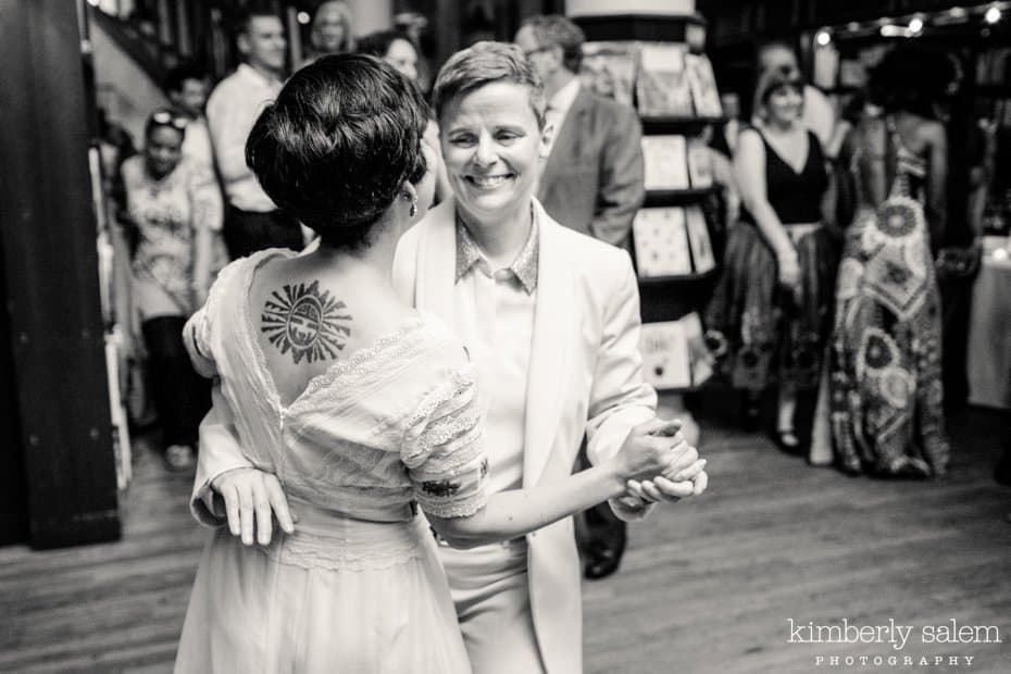 Brides smile during their first dance