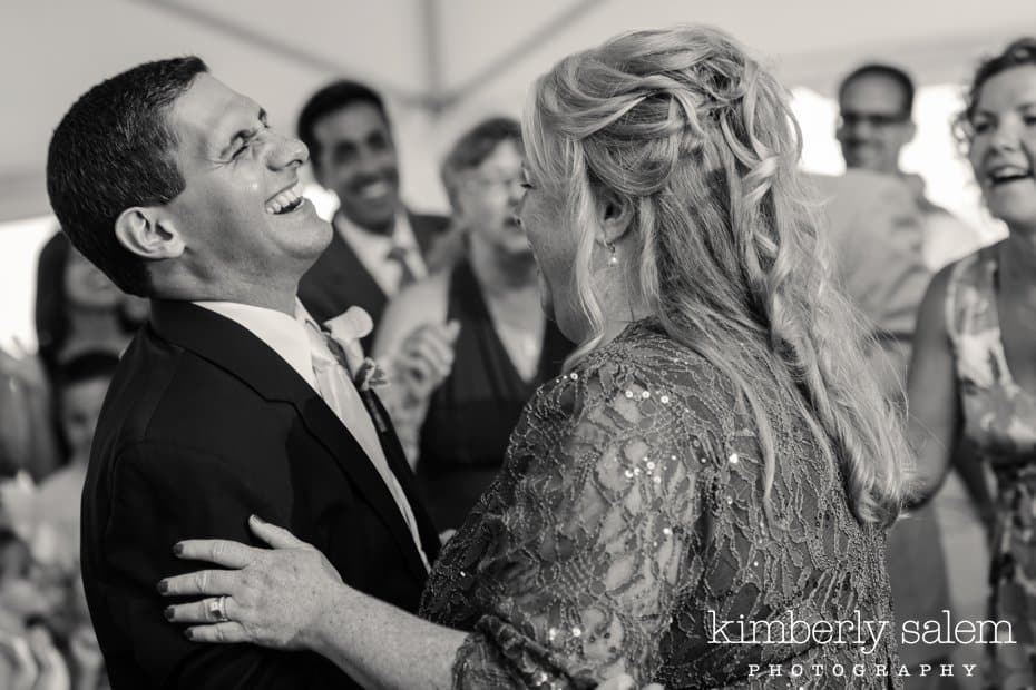 bride and groom laughing during first dance