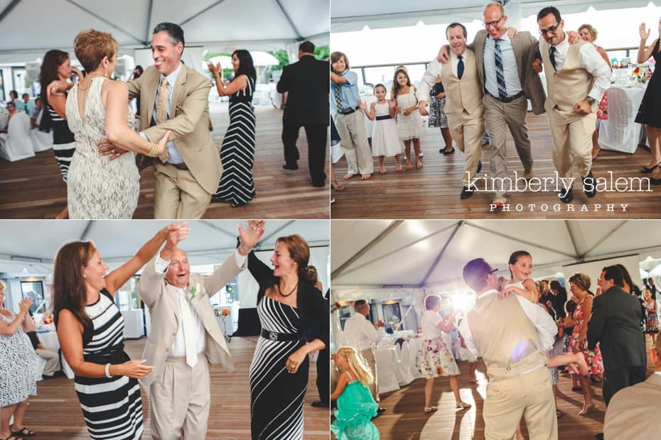 guests having fun dancing at the beach themed wedding reception