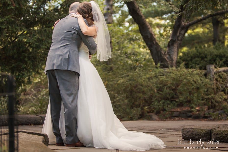 Bride and groom embrace after their wedding ceremony