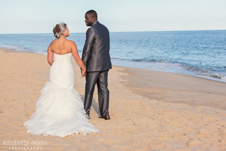 bride and groom on the beach at Gurney's Inn