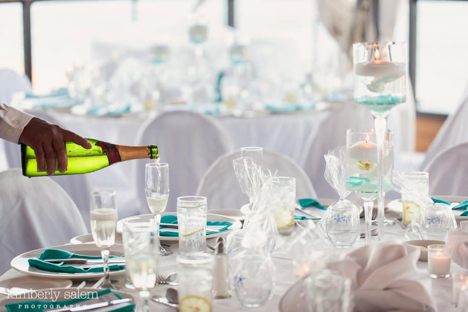 reception table details - white and blue - champagne pour