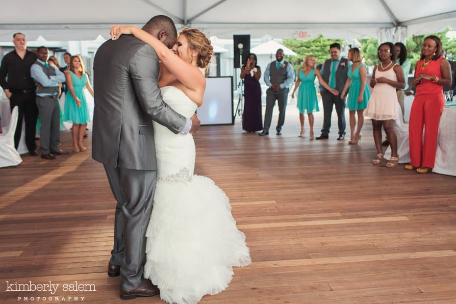 bride and groom first dance under the tent at Gurney's Inn